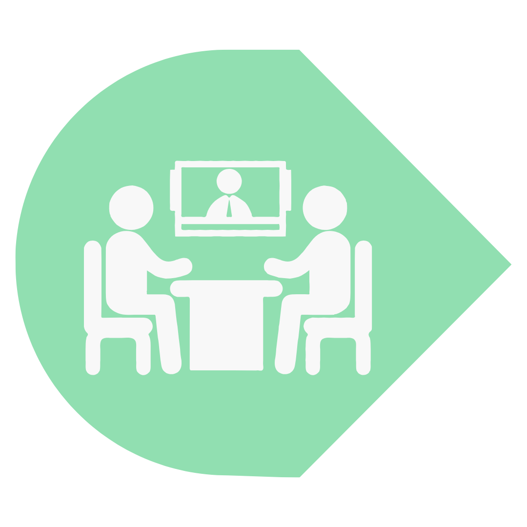 a green and white icon of two people sitting at a table